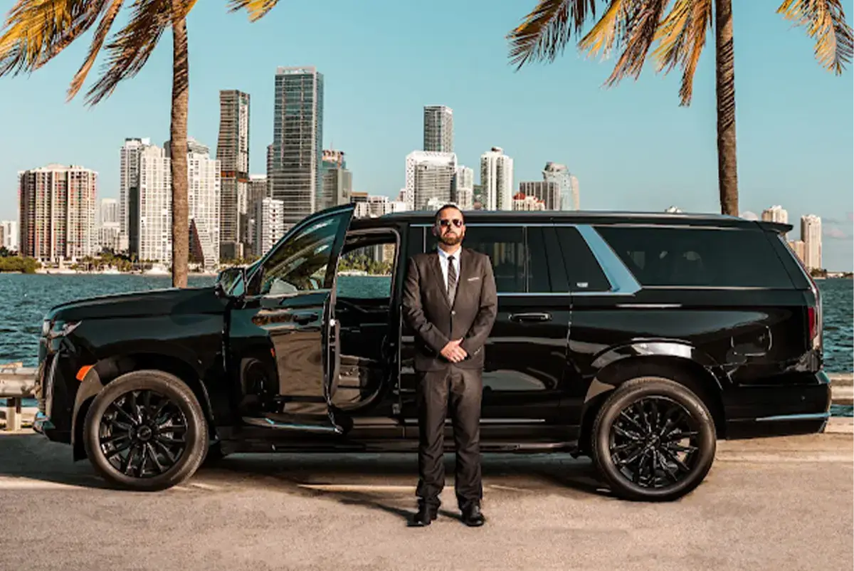 Professional Driver Awaiting Guests with an Escalade in Ft Lauderdale